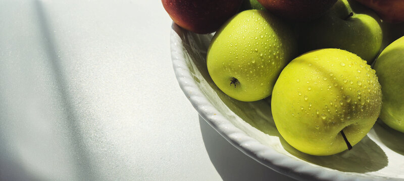 green apples in a bowl image with a place for text. organic food. healthy food diet