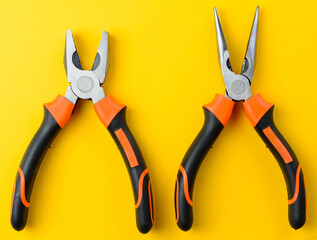 Two open metal pliers on bright yellow background, top view, repair tool
