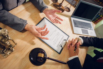 Businessmen consult with lawyers, submit additional documents, and pay for lawyers' services. After...