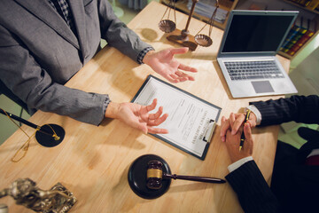 Businessmen consult with lawyers, submit additional documents, and pay for lawyers' services. After...