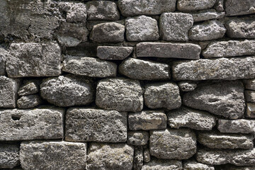 Empty old brown grain stone brick wall made with blocks for abstract background and texture. beautiful patterns, space for work, close up