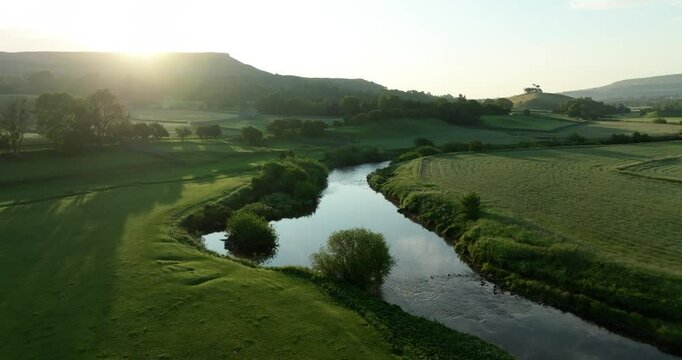 Aerial shot of calm river Ure in Wensleydale