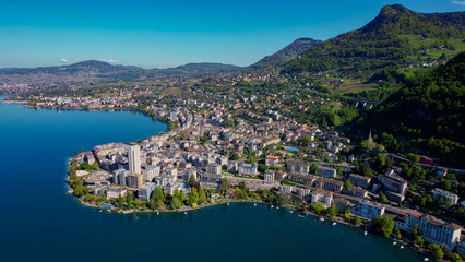 Obraz premium A panoramic aerial view around the old town of the city Montreux in Switzerland on a sunny spring noon
