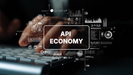 Hands Typing on Keyboard with Data Visuals, Concept of API Economy and Digital Innovation....