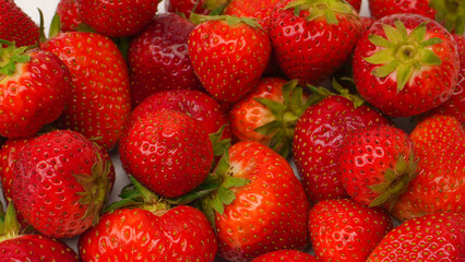 Fresh group of berries isolated on a white background.