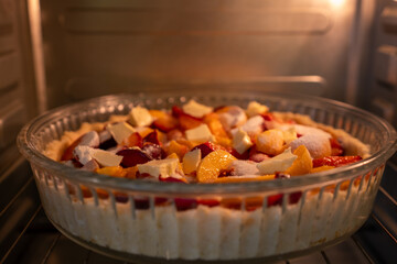 Berry Pie Baking: Daytime oven bakes homemade dessert for enjoyment in kitchen.