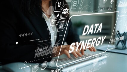 Professional Businesswoman Engaged in Data Analysis with Digital Interface Showing Data Synergy...