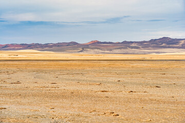 A breathtaking view of the arid desert terrain in Paracas National Reserve, Peru.
