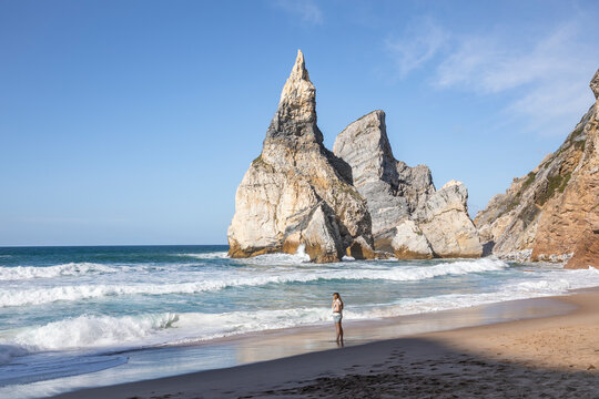 a woman on the Ursa beach (Praia da Ursa) near Cabo da Roca, Colares, Sintra, district of Lisbon, Portugal
