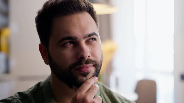 Pensive thoughtful Caucasian business man male guy homeowner model client businessman customer think touching chin gesture pondering choosing decide nodding head idea decision at home inside apartment