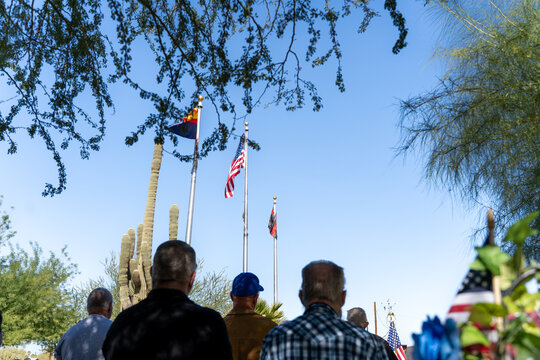 People looking at the flag