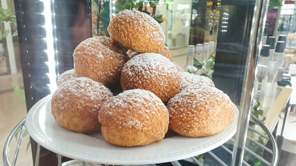 Custard cake, dessert bun Shu on display,flour product with cream, bakery.