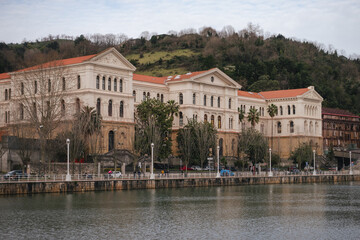 Naklejka premium Historic building of the University of Deusto facing the Bilbao estuary.