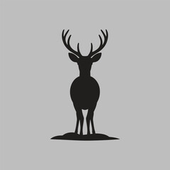 This captivating illustration features a bold black silhouette of a deer with prominent antlers, standing on a small mound against a soft gray background.
