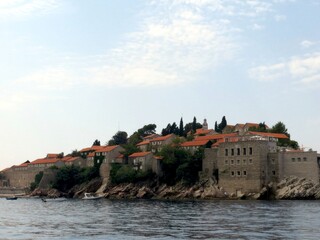 Beautiful View of Sveti Stefan Resort Island in Montenegro With Clear Skies and Tranquil Waters