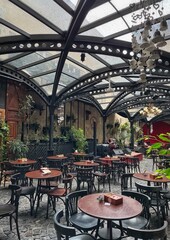 Chic Café Interior with Glass Ceiling and Live Music Stage