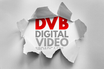 DVB abbreviation for Digital Video Broadcasting exposed through torn paper. Concept for TV signal...