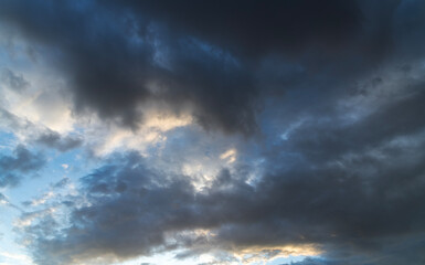 Beautiful bright sunset sky background with clouds. Evening time.