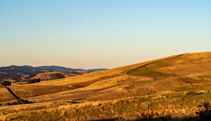 Fototapeta premium Golden Hour Landscape of Rolling Hills