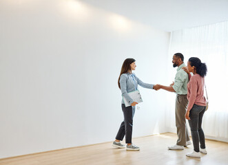 Female Real Estate Agent Selling And Showing The Modern Apartment To His Young Clients couple and...