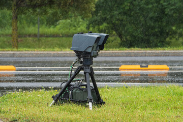 A mobile system for automatic detection of speed limit violations, installed on a tripod on the...