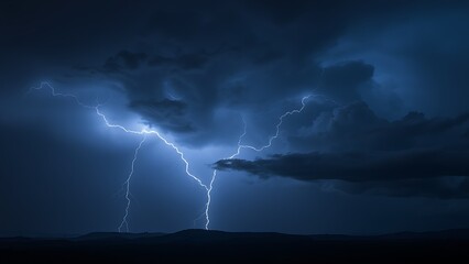 Dramatic lightning strike over a dark stormy landscape with electric blue flashes illuminating clouds.