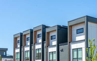 Top of modern apartment building with balcony, trees and beautiful landscape in Vancouver, Canada, North America. Day time on June 2025.