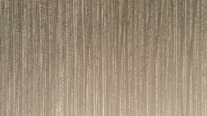 Textured surface with vertical lines creating a unique pattern. Ideal for backgrounds, wallpaper,...