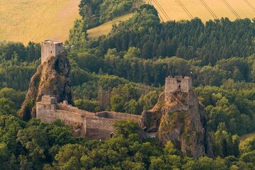 Landscape of Bohemian Paradise with Trosky Castle at summer sunrise.