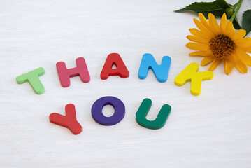 Thank you. wooden colored letters made a message to thank you