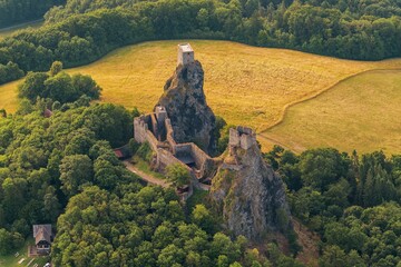 Landscape of Bohemian Paradise with Trosky Castle at summer sunrise.