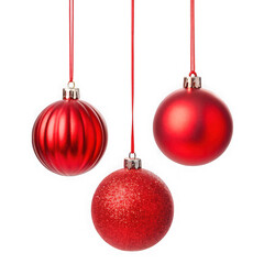 Three shiny red christmas ornaments hanging on red ribbons against a black background