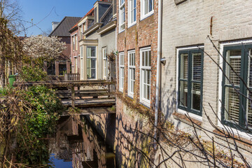 Wooden bridge over a narrow canal in Den Bosch, Netherlands