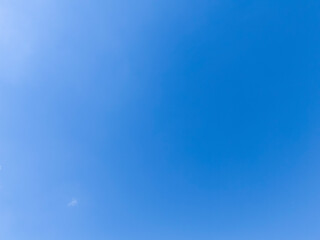 Clear blue sky with minimal clouds, perfect for backgrounds or nature themes. Ideal for...