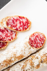 Dry-cured sausage pork meat smoked food fresh delicious gourmet food background on the table rustic food top view copy space