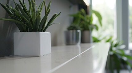 Sleek flat-screen TV displayed on minimalist white shelf, modern home entertainment and technology concept for living room interior design.
