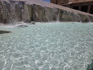 Tranquil fountain cascading water in Zaragoza urban landscape. Aragon, Spain. Summer in Zaragoza....