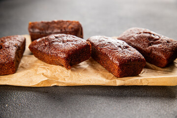 Financier biscuit chocolate cookie sweet dessert fresh delicious gourmet food background on the table rustic food top view copy space