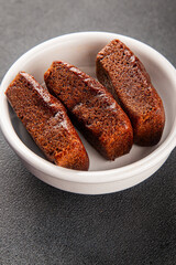 Financier biscuit chocolate cookie sweet dessert fresh delicious gourmet food background on the table rustic food top view copy space