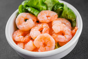 Shrimp salad prawns seafood fresh pescetarian diet gourmet food background on the table rustic food...