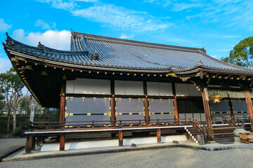 The Main Hall, or Kondo, of Ninna-ji Temple in Kyoto, a national treasure, displays its elegant traditional architecture with sliding screens and a tiled roof, set within a peaceful gravel courtyard.