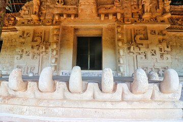 Magnificent white stucco façade and entrance to the tomb of Ukit  Kan Lek Tok through the jaws of...