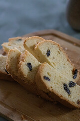Sliced Bread and Cake on Wooden Cutting Board