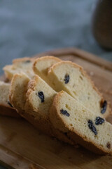 Sliced Bread and Cake on Wooden Cutting Board