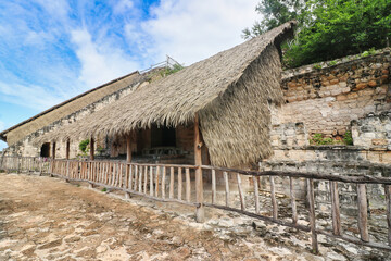 Thatched roofs protect the burial and offerings chambers of the Tomb of Ukit Kan Lek Tok on the...