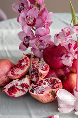 Pomegranate and Flowers Arrangement with Vibrant Colors