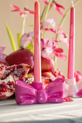 Festive Table Setting with Candles and Floral Decor