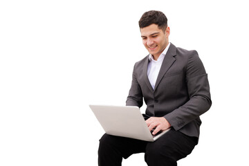Smiling professional engaged in work while seated with laptop on a isolated transparent background