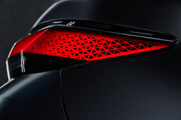 LED turn signal in the rear brake light of the car. Modern car lantern, close-up. Detail on the...