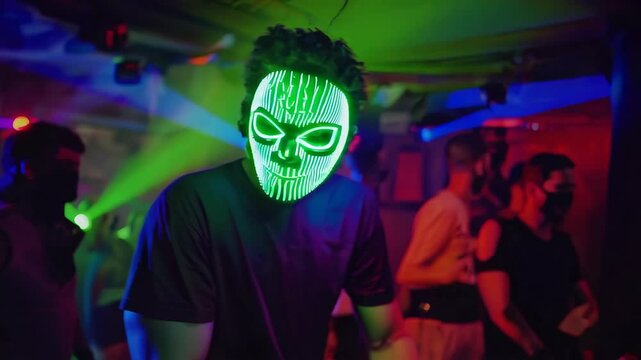 Man with halloween led mask in a party club dancing. Purge film mask